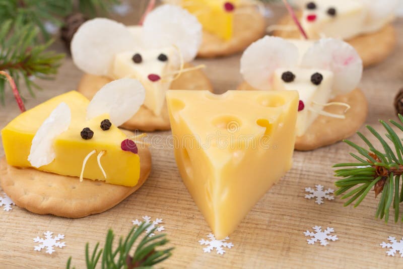 Festive food for the New Year 2020 - the year of white rat. Mice around a piece of cheese. royalty free stock photography Festive food for the New Year 2020 - the year of white rat. Mice around a piece of cheese. royalty free stock photography