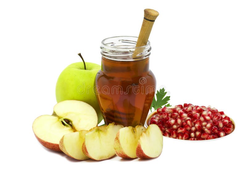 Festive fruits and jar of honey on white