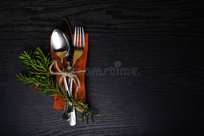 Winter holiday dinner plate decoration on black wood background. table set with a winter, Christmas decoration. Winter holiday the royalty free stock images Winter holiday dinner plate decoration on black wood background. table set with a winter, Christmas decoration. Winter holiday the royalty free stock images