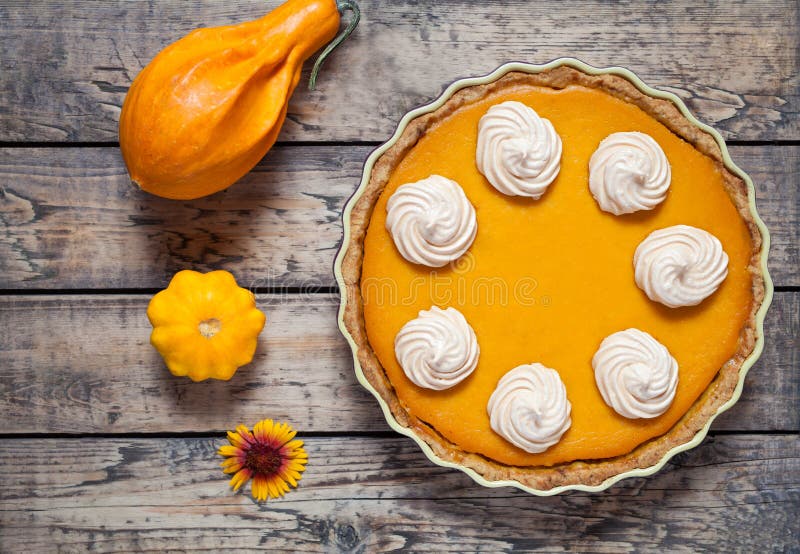 Festive Homemade Pumpkin pie with whipped cream made for Thanksgiving and h...