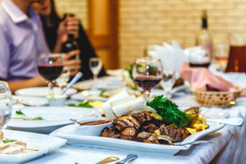 a festive table with food and glasses in a restaurant or banquet