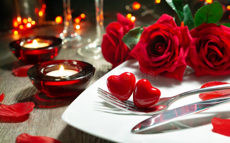 Festive table place setting for Valentines day dinner