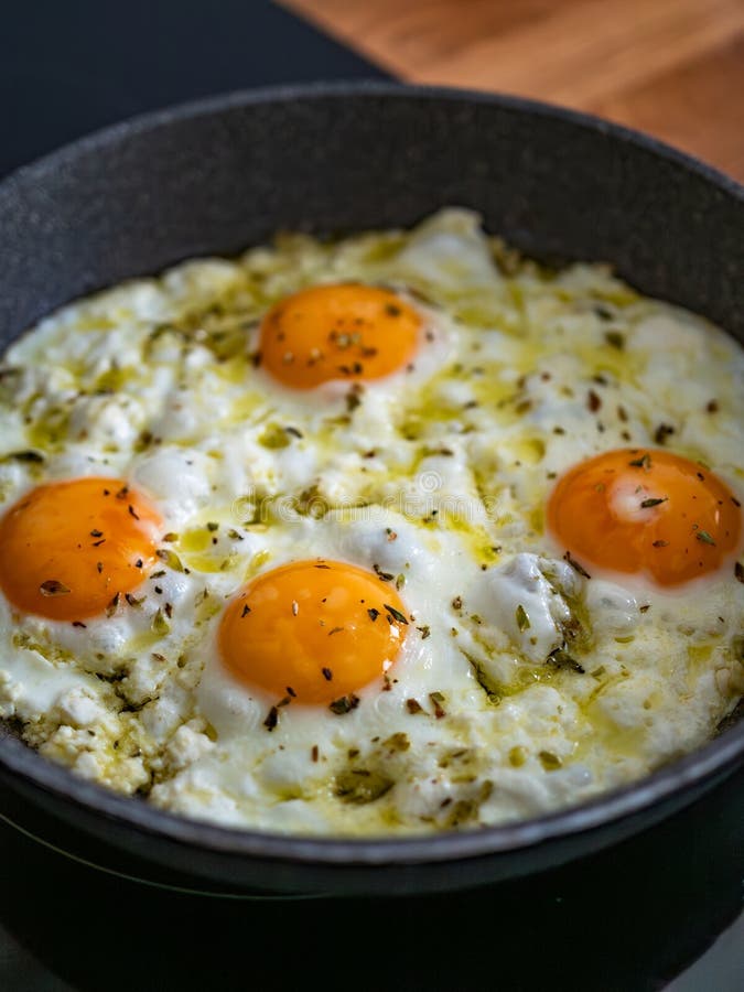 Feta fried eggs in frying pan on electric stove. Frying pan stock images, royalty-free photos and pictures