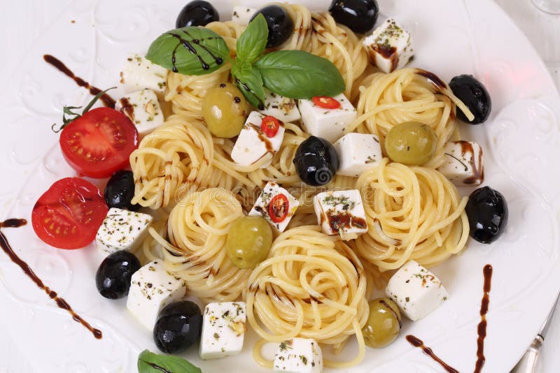 Feta with Spaghetti with Olives, Tomatoes and Sauce Stock Photo Image