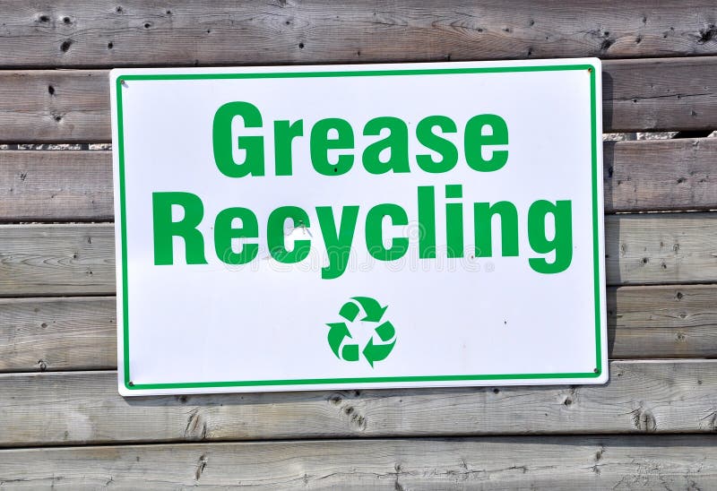 Grease recycling sign posted in wooden wall. Grease recycling sign posted in wooden wall