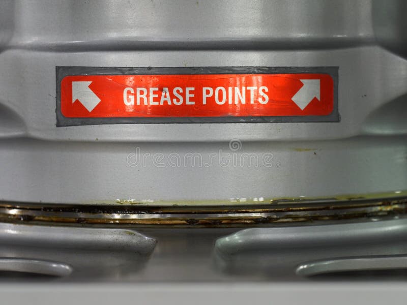 A grease point label close up. Label placed on aircrafts or boats with steel mechanisms in need of lubrification. A grease point label close up. Label placed on aircrafts or boats with steel mechanisms in need of lubrification