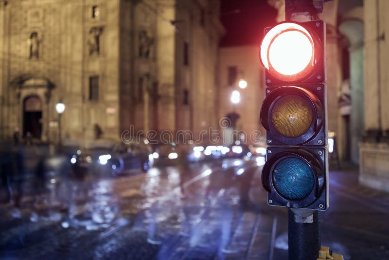 Red light on traffic lights against crosswalk. Night scene of city street in Prague, Czech Republic. Red light on traffic lights against crosswalk. Night scene of city street in Prague, Czech Republic