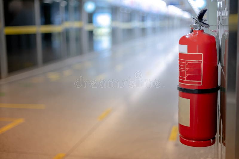 Fire extinguishers hanging on the wall available in fire emergencies at the subway station. Fire extinguishers hanging on the wall available in fire emergencies at the subway station.