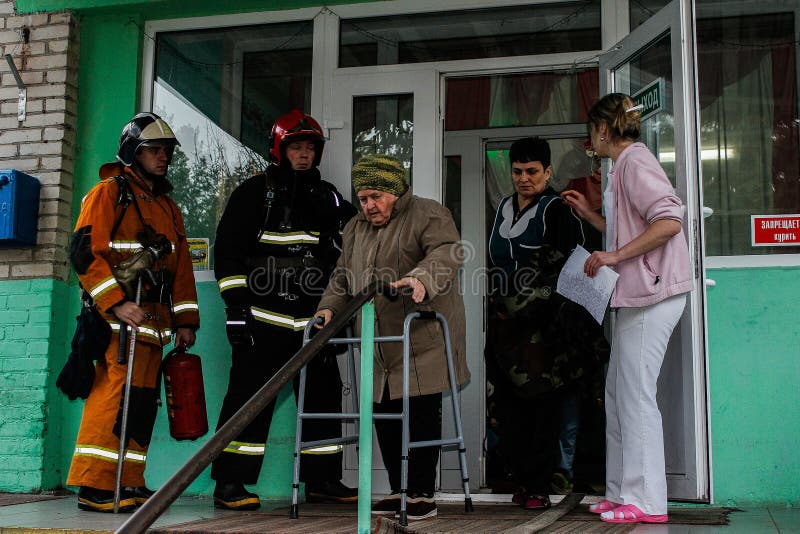 Fire evacuation at nursing home in Gomel region of the Republic of Belarus. In social institutions of Belarus, the emergencies Ministry regularly conducted exercises, which worked through the behaviour of staff and citizens in the event of a fire hazard. This shot is made during evacuation drills, conducted in a boarding house for the elderly, located in the tract Shubine near the city of Gomel. Fire evacuation at nursing home in Gomel region of the Republic of Belarus. In social institutions of Belarus, the emergencies Ministry regularly conducted exercises, which worked through the behaviour of staff and citizens in the event of a fire hazard. This shot is made during evacuation drills, conducted in a boarding house for the elderly, located in the tract Shubine near the city of Gomel.