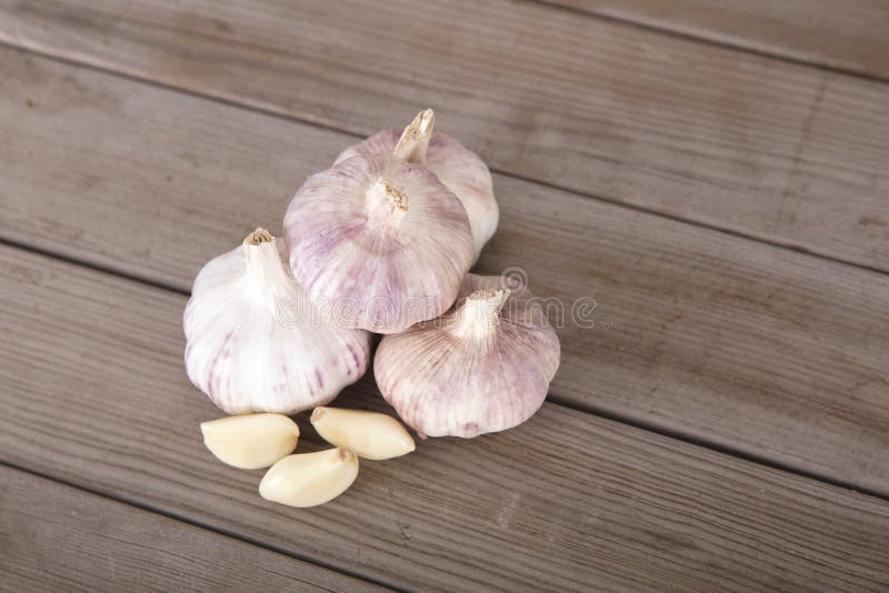 A Few Heads of Fresh Garlic and Peeled Garlic Cloves Stock Image