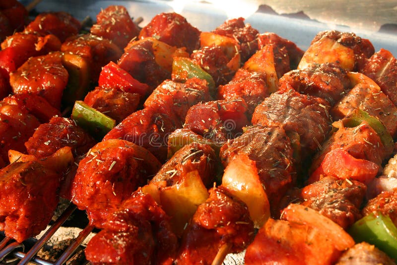 Few Meat Brochettes on a Barbecue stock photos Few Meat Brochettes on a Barbecue stock photos