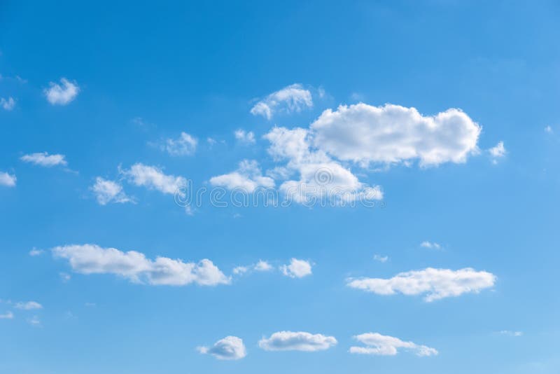 Few Random White Clouds In Blue Sky Partly Cloudiness Stock Photo