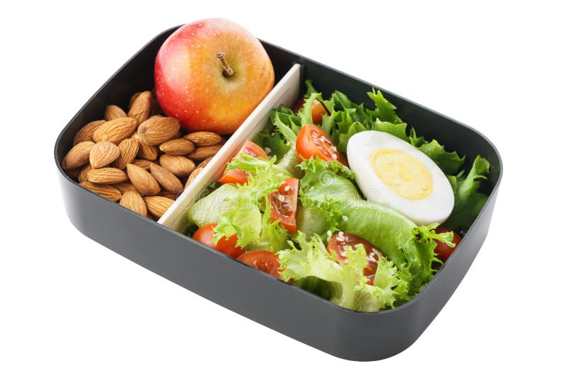 Fiambrera vegetariana sana con la ensalada, las nueces y la manzana aislante imagen de archivo Fiambrera vegetariana sana con la ensalada, las nueces y la manzana aislante imagen de archivo