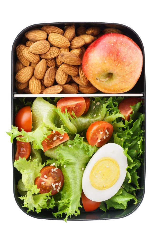 Fiambrera vegetariana sana con la ensalada, las nueces y la manzana aislante fotografía de archivo libre de regalías Fiambrera vegetariana sana con la ensalada, las nueces y la manzana aislante fotografía de archivo libre de regalías