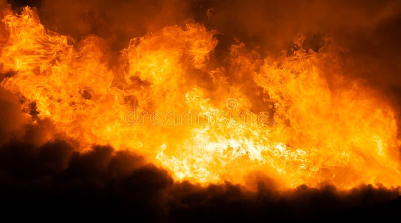 Arson or nature disaster - burning fire flame on wooden house roof. Arson or nature disaster - burning fire flame on wooden house roof