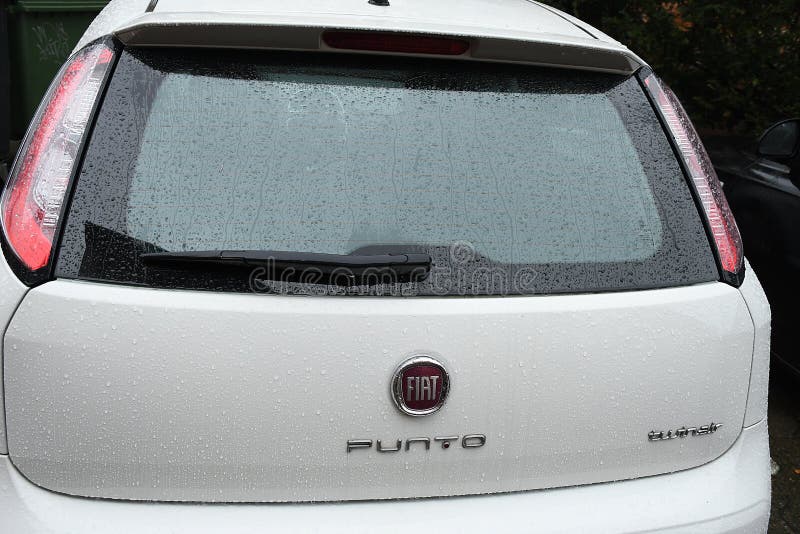 Old Red Fiat Punto Fourdoors Parked Editorial Stock Image - Image