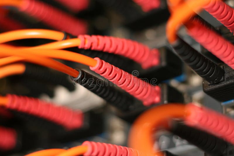 Fiber optic cables. Plugged into telecom switch Fiber optic cables. Plugged into telecom switch