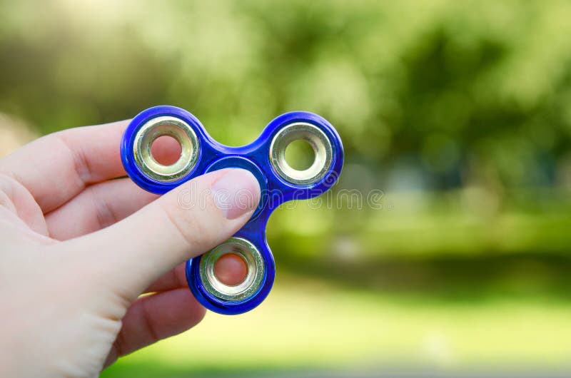 Fidget spinner in hand close up royalty free stock images Fidget spinner in hand close up royalty free stock images