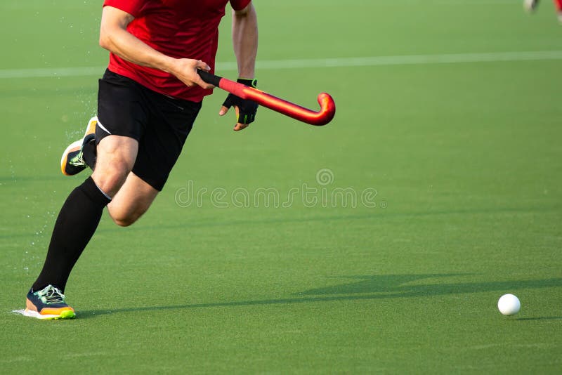 Field Hockey Player on Artificial Grass Play Field. Stock Photo Image