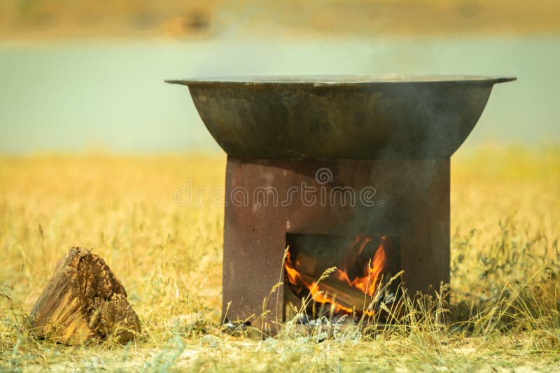 Field Kitchen. a Large Cauldron is Heated on a Brazier Stock Image