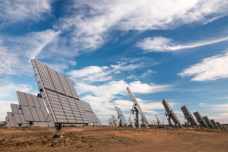 Field of photovoltaic solar panels gathering energy.