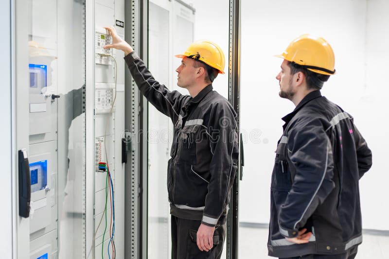 Field service crew testing electronics or inspecting electrical stock photos
