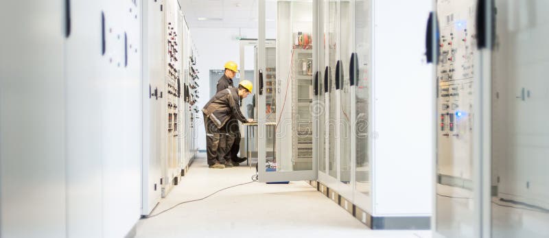 Field service crew testing electronics or inspecting electrical stock photos