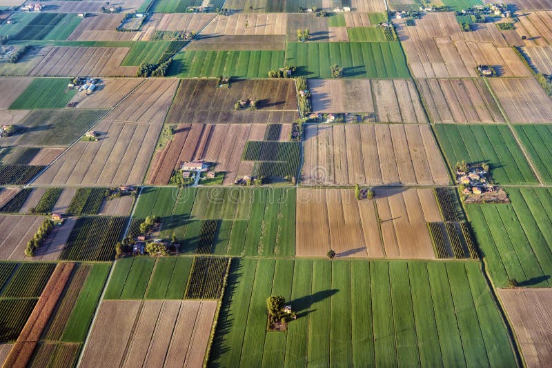 Fields of Po Valley - aerial view in evening light. Aerial view agricultural land. Autumn fields at Po Valley near Bologna, Italy