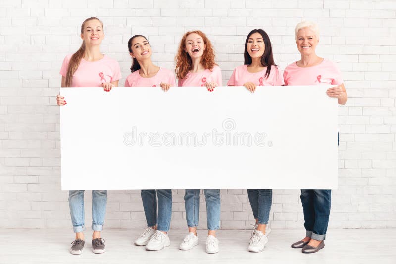 Multiethnic Women Holding Empty White Poster Over Brick Wall, Mockup royalty free stock photography Multiethnic Women Holding Empty White Poster Over Brick Wall, Mockup royalty free stock photography