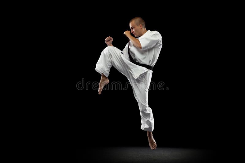 Full-length Portrait of Young Sportsman Training Karate Isolated Over Black  Background. in Motion Stock Image - Image of practice, strong: 229676565