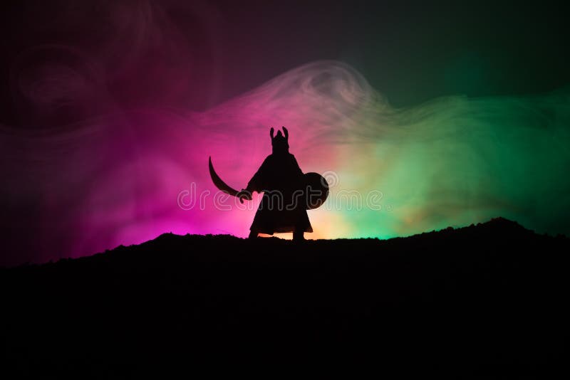 Fighter with a sword silhouette a sky. Medieval knight with sword. Selective focus royalty free stock photos Fighter with a sword silhouette a sky. Medieval knight with sword. Selective focus royalty free stock photos