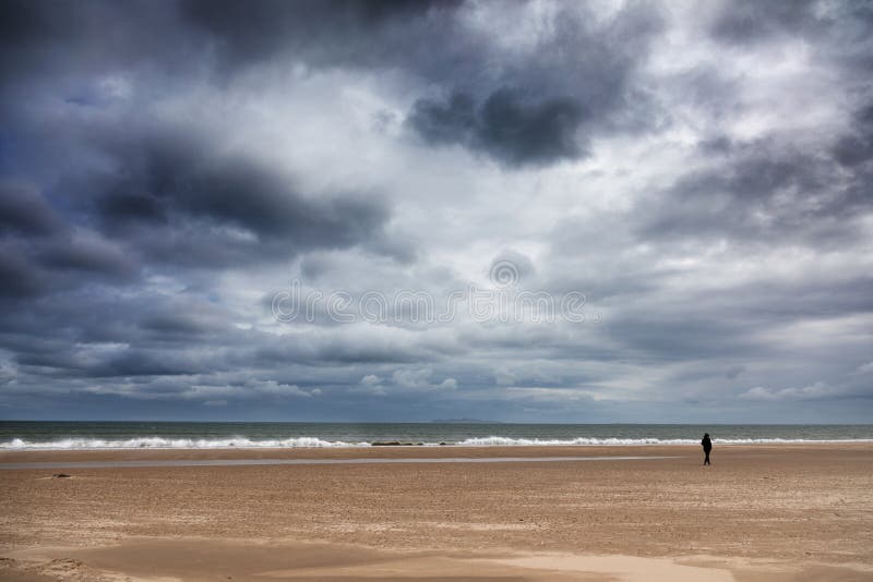 Figura isolata alla spiaggia di Harve Aubert immagini stock libere da diritti Figura isolata alla spiaggia di Harve Aubert immagini stock libere da diritti