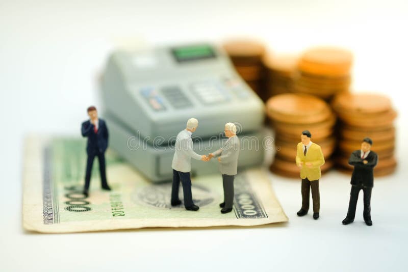 Figura miniatura: Apretón de manos de los hombres de negocios imagenes de archivo Figura miniatura: Apretón de manos de los hombres de negocios imagenes de archivo