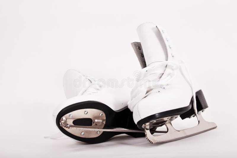 Pair of women figure skates on white background. Pair of women figure skates on white background