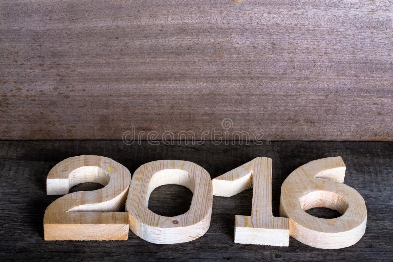 Figure di legno leggere 2016 su fondo di legno grigio nel retro vin fotografie stock Figure di legno leggere 2016 su fondo di legno grigio nel retro vin fotografie stock