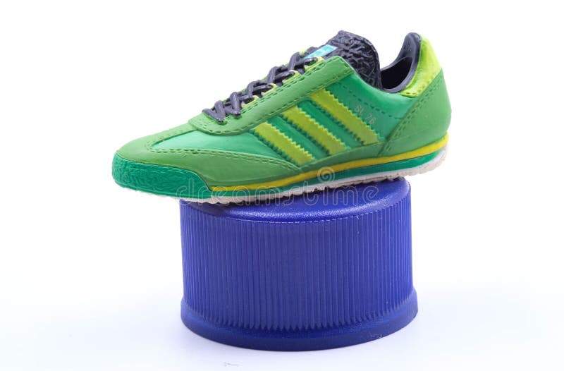 bottle green adidas trainers