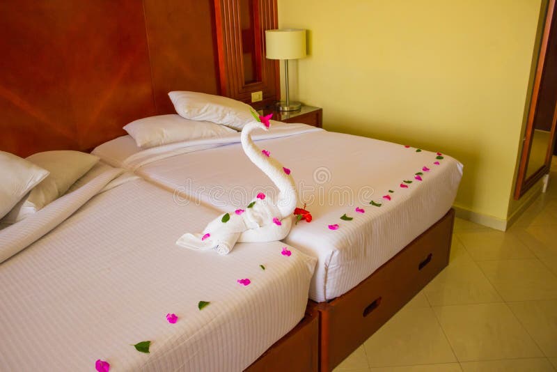 Figure of swans made out of towels on the bed. royalty free stock photos Figure of swans made out of towels on the bed. royalty free stock photos