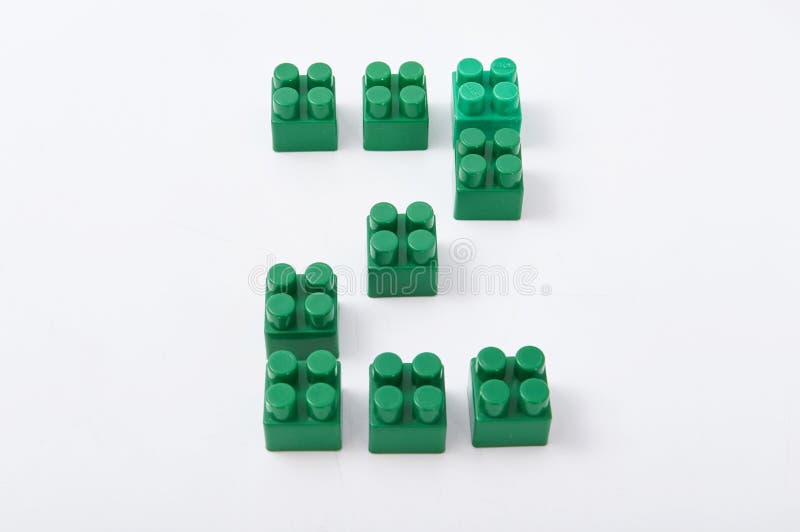 Figures from a colored cubes designer on a white background royalty free stock photo