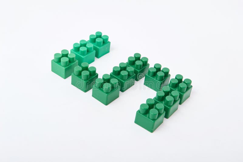 Figures from a colored cubes designer on a white background stock image