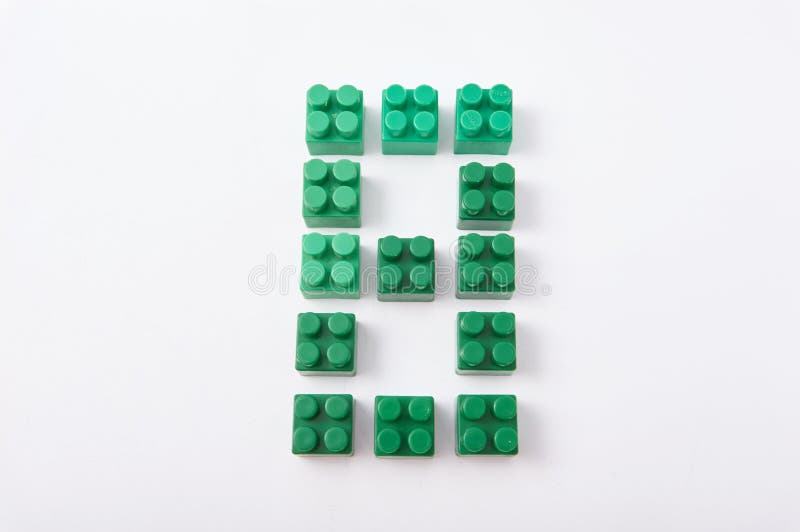 Figures from a colored cubes designer on a white background stock photography