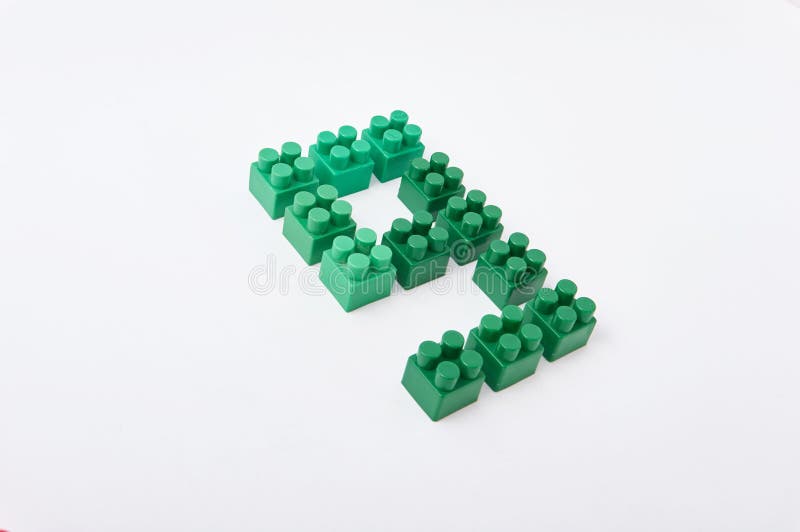 Figures from a colored cubes designer on a white background stock photo