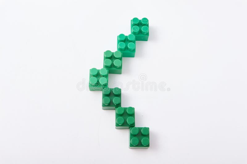 Figures from a colored cubes designer on a white background royalty free stock images