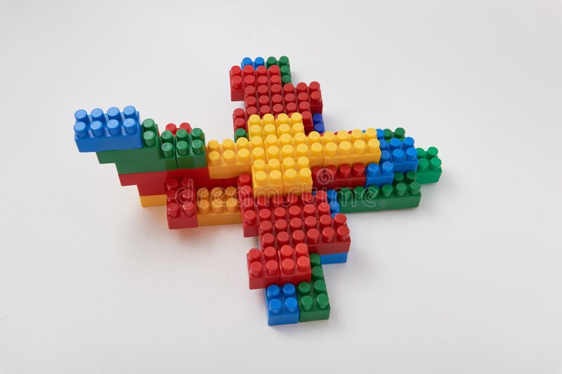 Figures from a colored cubes designer on a white background stock image