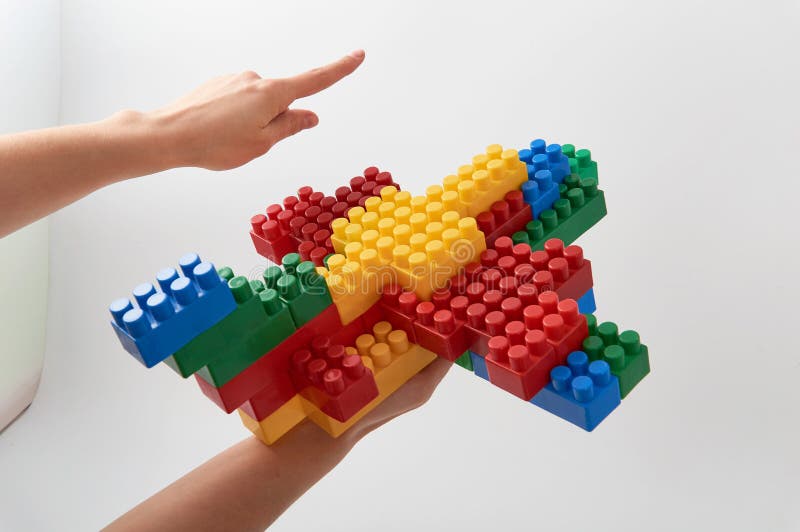 Figures from a colored cubes designer on a white background stock image