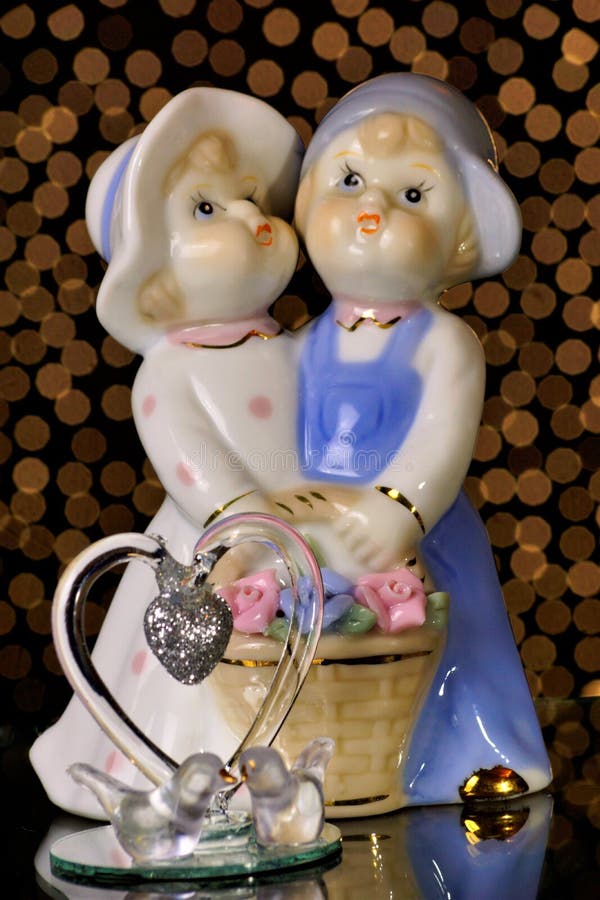 Figures lovers and pigeons. St. Valentine`s day is a holiday, people confess their love to each other. Celebrate this holiday stock photos Figures lovers and pigeons. St. Valentine`s day is a holiday, people confess their love to each other. Celebrate this holiday stock photos