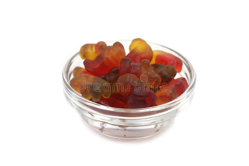 Figures made â€‹â€‹of colored jelly in a glass container royalty free stock images