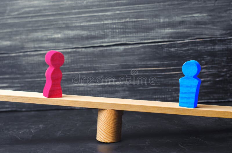 Figures of a man and a woman on the scales. inequality concept : man and women on a weighing balance, gender pay gap. divorce. Div. Ision of property in court royalty free stock photo Figures of a man and a woman on the scales. inequality concept : man and women on a weighing balance, gender pay gap. divorce. Div. Ision of property in court royalty free stock photo