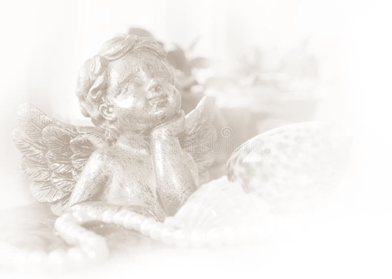 Figurine of an angel in bright colors. Vintage postcard royalty free stock photo Figurine of an angel in bright colors. Vintage postcard royalty free stock photo