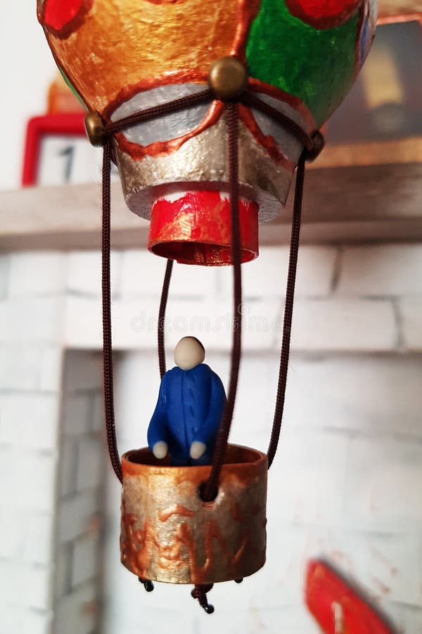 Figurine pilot in a miniature balloon royalty free stock images