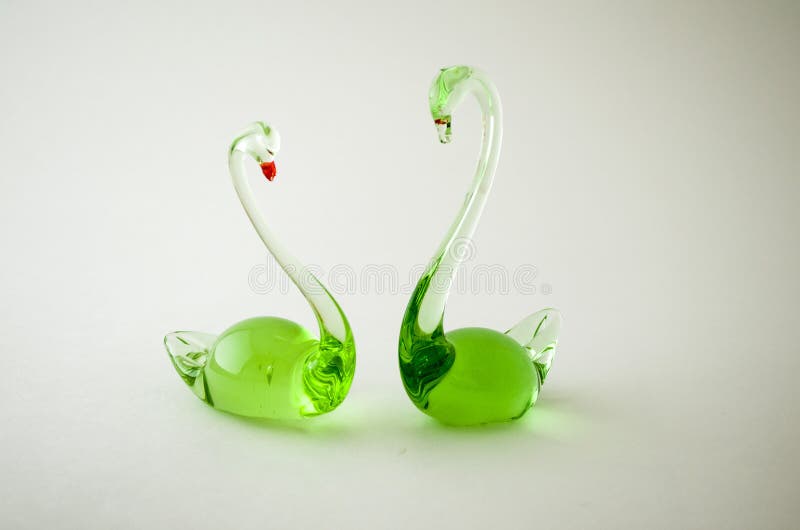 Figurines made of glass. stock image. Image of swans 84420261